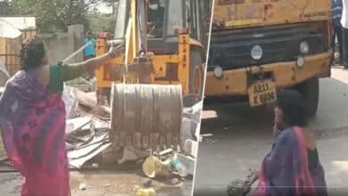 Outrage in Uppal: Woman's Shocking Protest Against GHMC Booth Demolition!