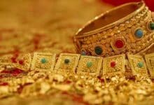 Gold reaches record high, poised for best month in 14 years