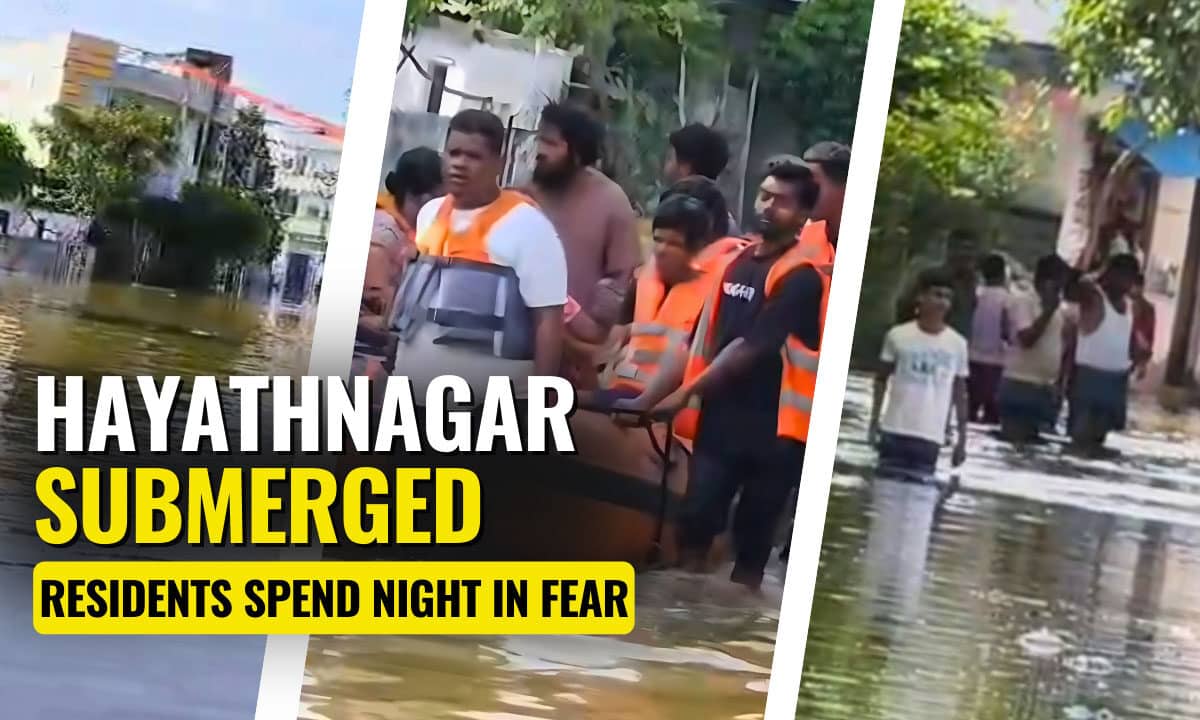 GHMC officials and residents wading through the flooded streets of Banjara Colony in Hayathnagar after heavy rainfall on Sunday night.